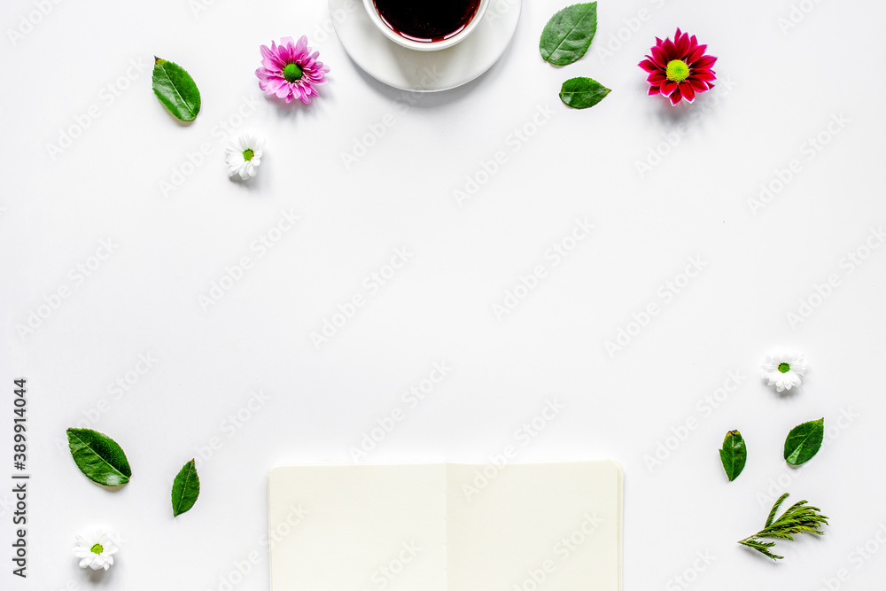 Copybook, americano and flowers on white table top view mock-up