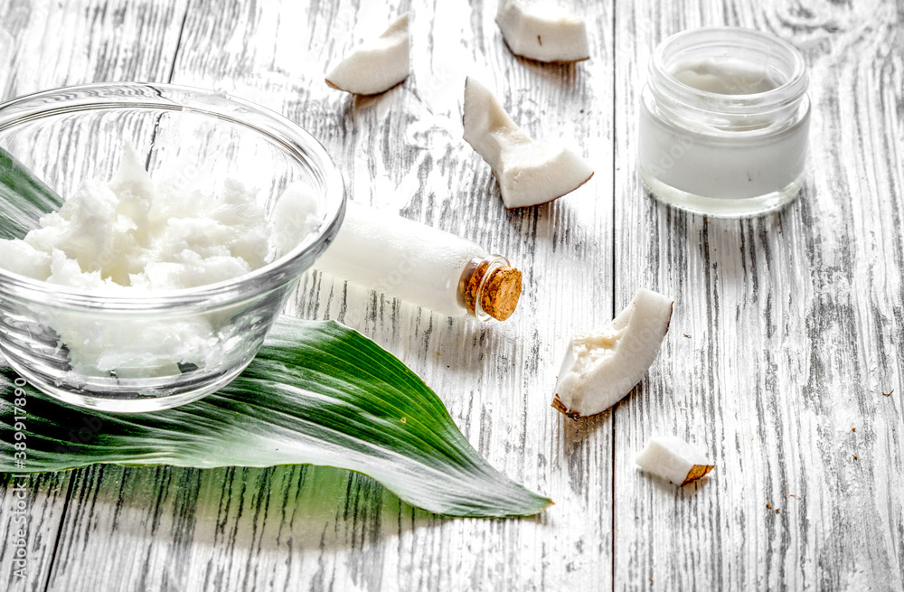 organic cosmetics with coconut on wooden background close up