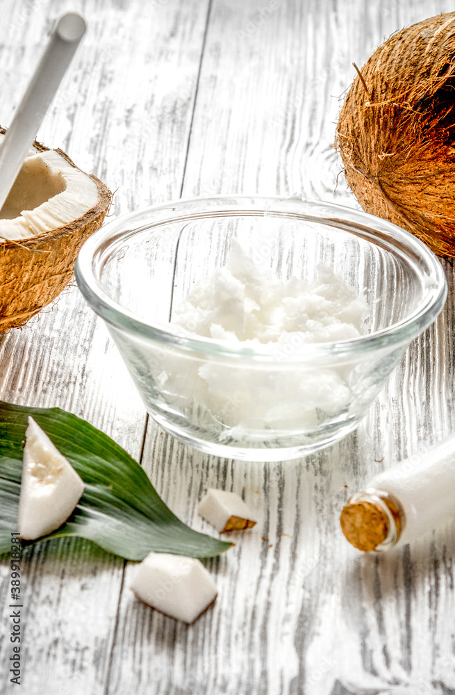 organic cosmetics with coconut on wooden background close up