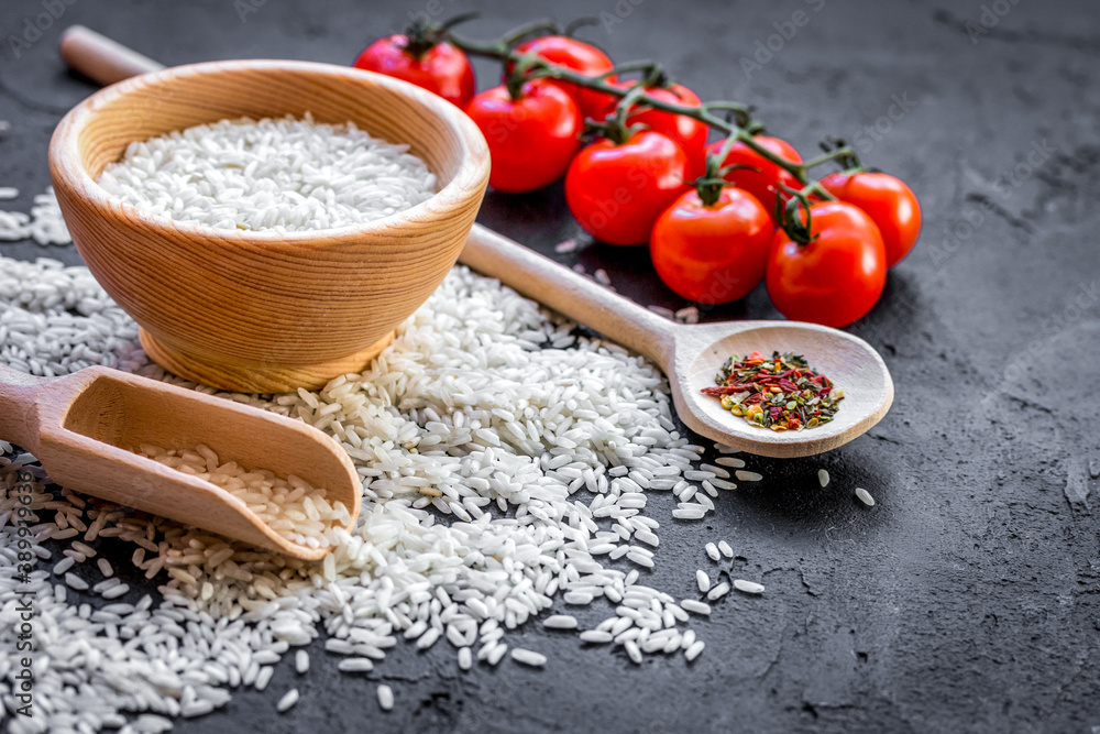 ingredients for paella on dark background