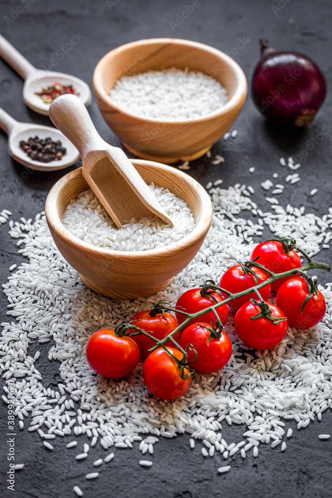 ingredients for paella on dark background