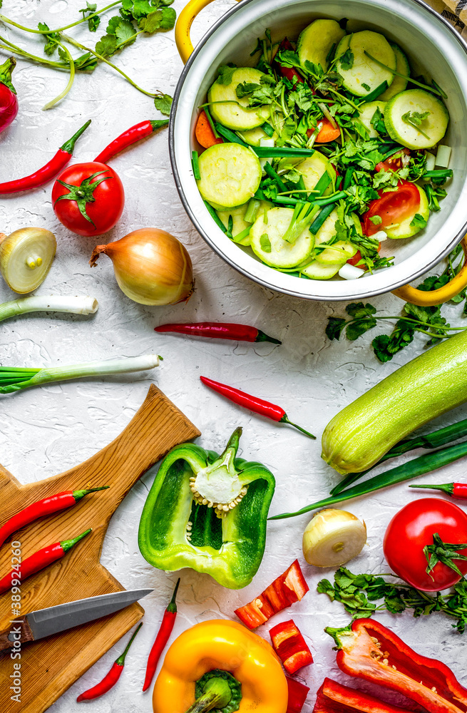 cooking vegetables on the stone background top view