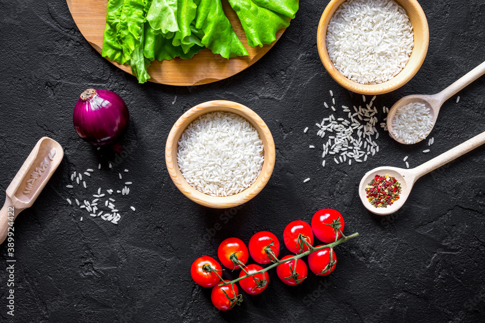 ingredients for paella on dark background top view