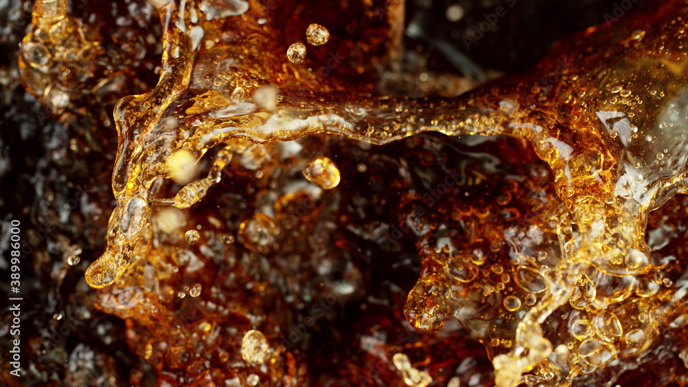 Splashing cola or ice tea, top view