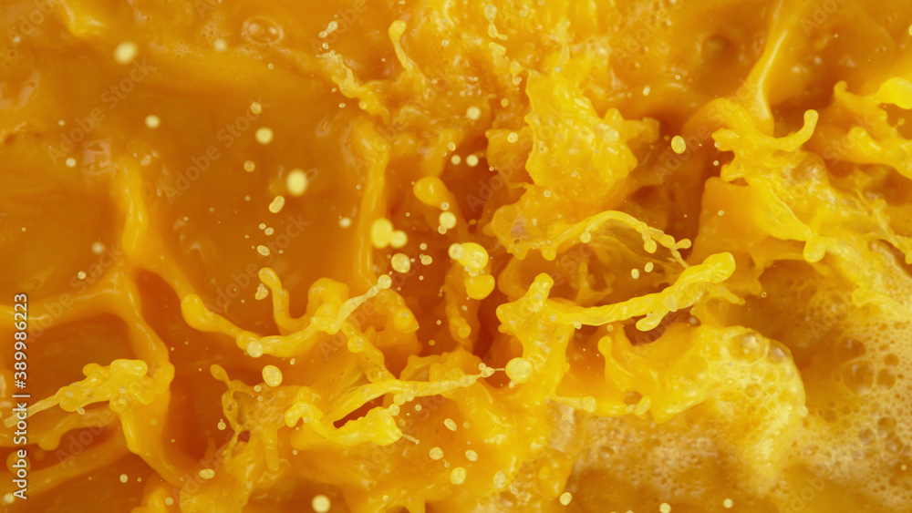 Closeup of splashing orange juice