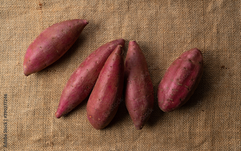 Sweet potatoes on the background of a hempenware