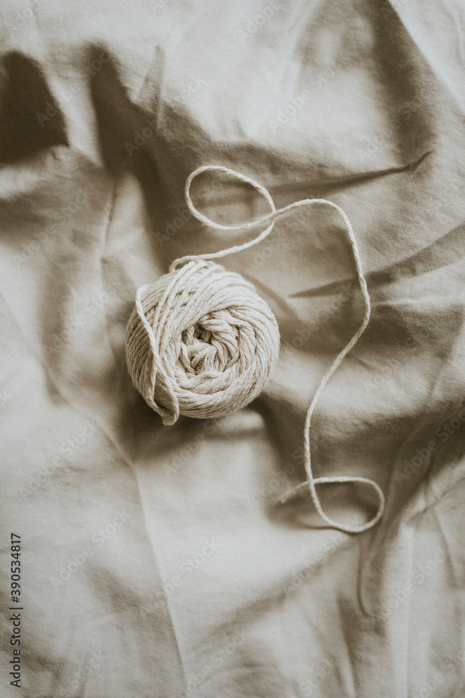 Natural cotton yarn on gray textile background