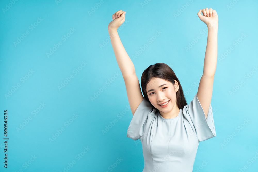 Asian woman showing feelings of triumph
