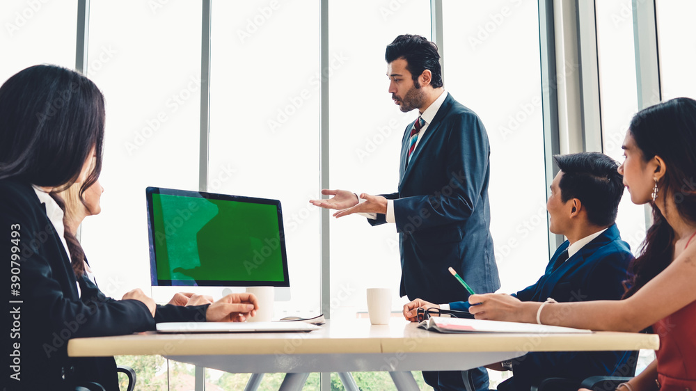 Business people in the conference room with green screen chroma key TV or computer on the office tab