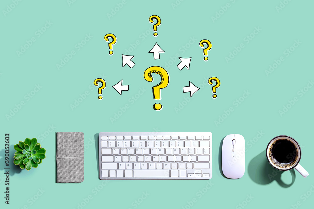 Big and small question marks with arrows with a computer keyboard and a mouse