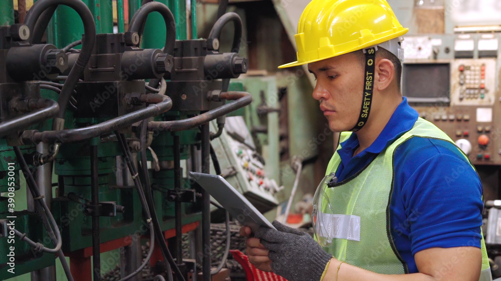 Smart factory worker using machine in factory workshop . Industry and engineering concept.