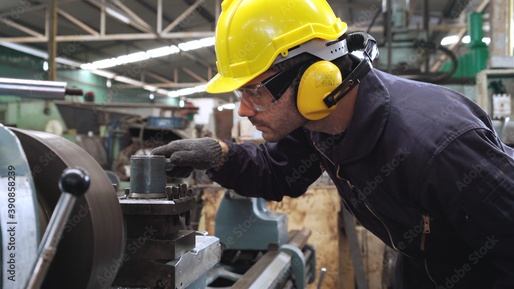 Smart factory worker using machine in factory workshop . Industry and engineering concept.