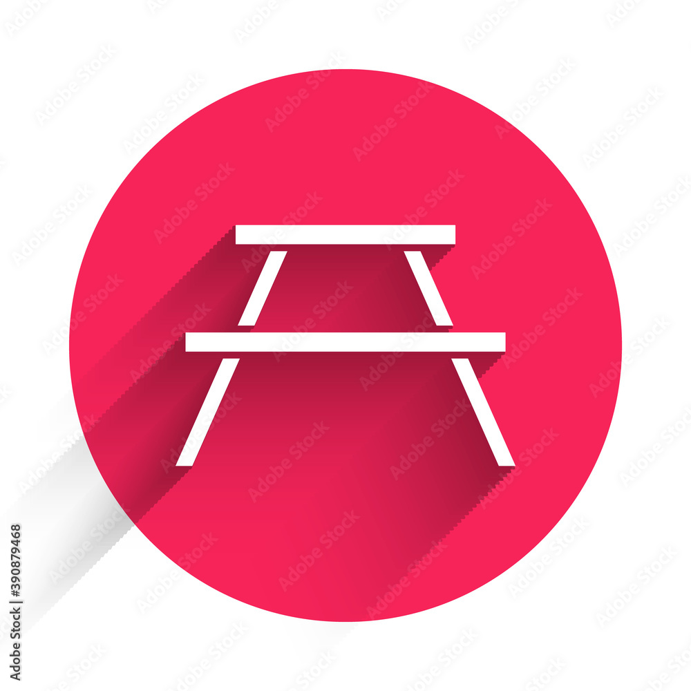 White Picnic table with benches on either side of the table icon isolated with long shadow. Red circ