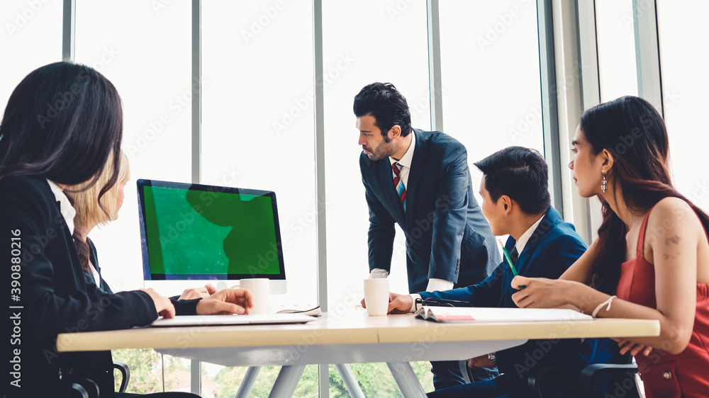 Business people in the conference room with green screen chroma key TV or computer on the office tab