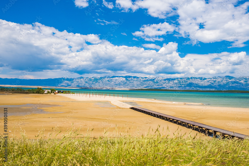 Sand lagoon near town of Nin in Dalmatia, Croatia. Adriatic coastline and Velebit mountain in backgr