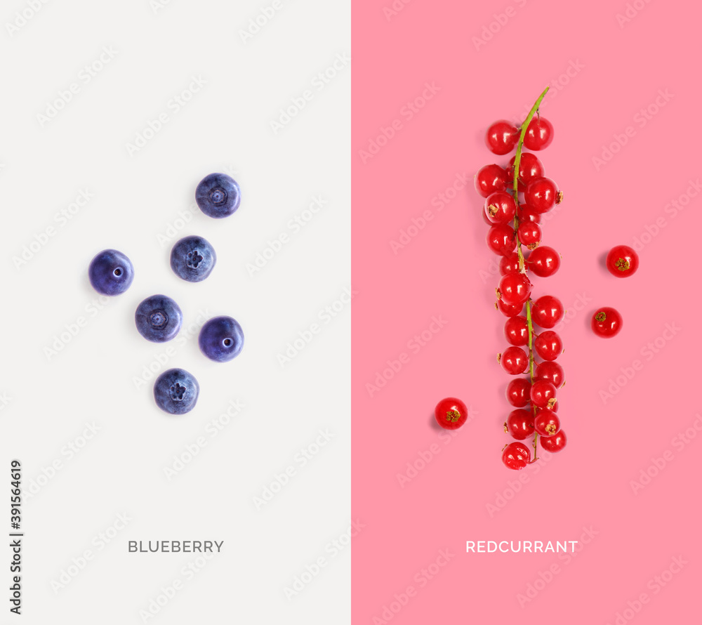 Creative layout made of redcurrant and blueberry. Flat lay. Food concept. 