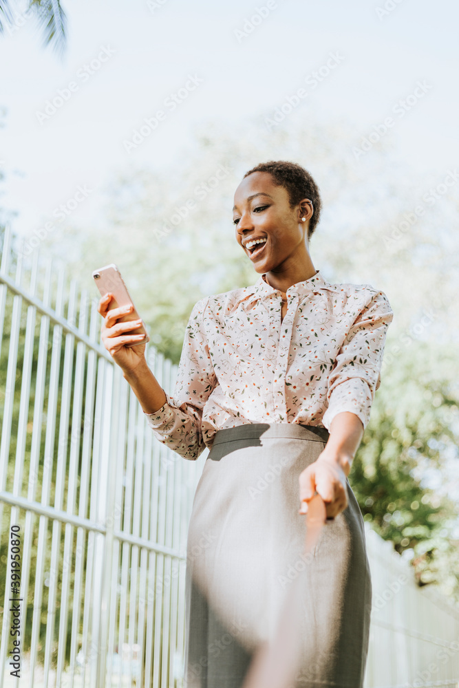 Woman using smartphone outdoors