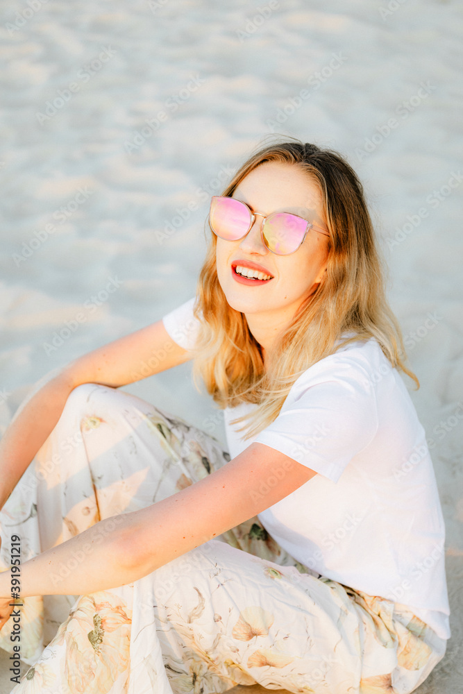 Woman in a casual summer outfit at the beach