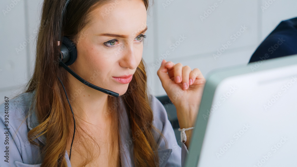 Business people wearing headset working in office to support remote customer or colleague. Call cent