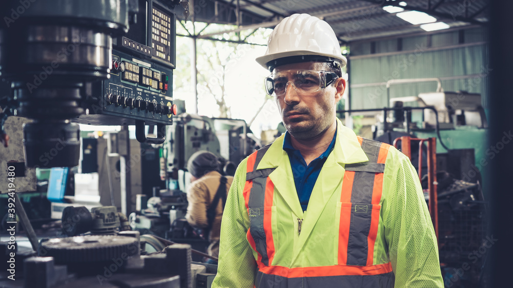 Smart factory worker using machine in factory workshop . Industry and engineering concept.