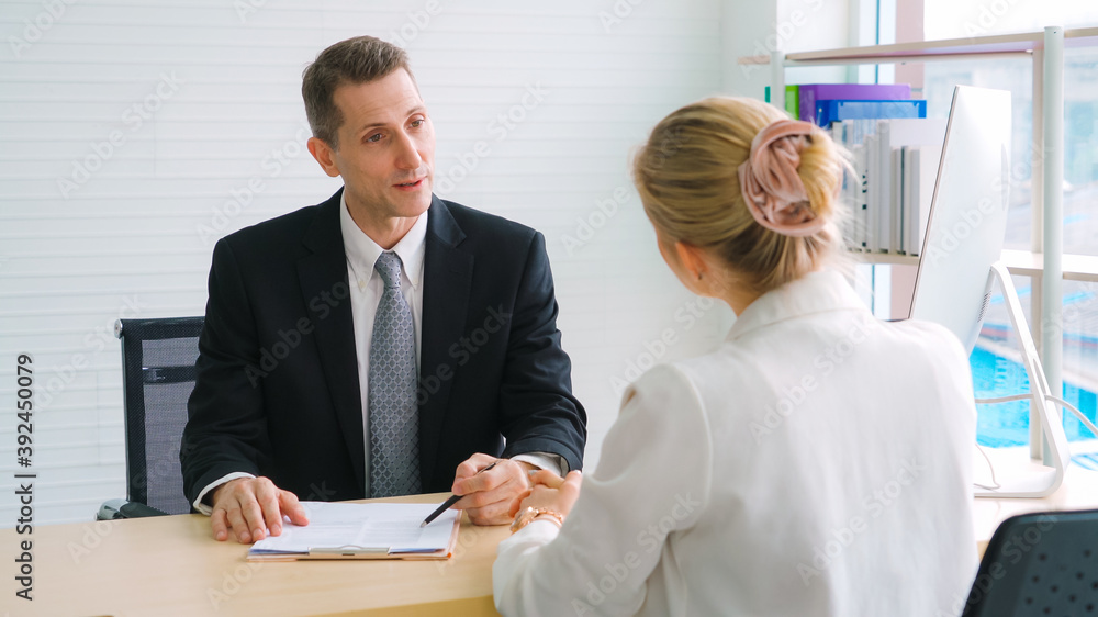 Job seeker in job interview meeting with manager and interviewer at corporate office. The young inte