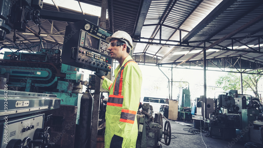 Smart factory worker using machine in factory workshop . Industry and engineering concept.