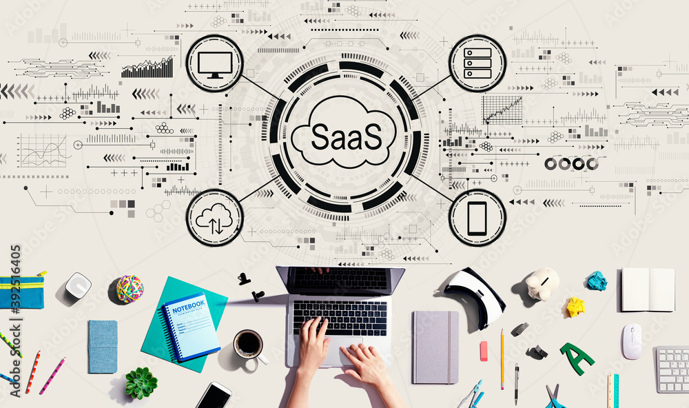 SaaS - software as a service concept with person using a laptop computer