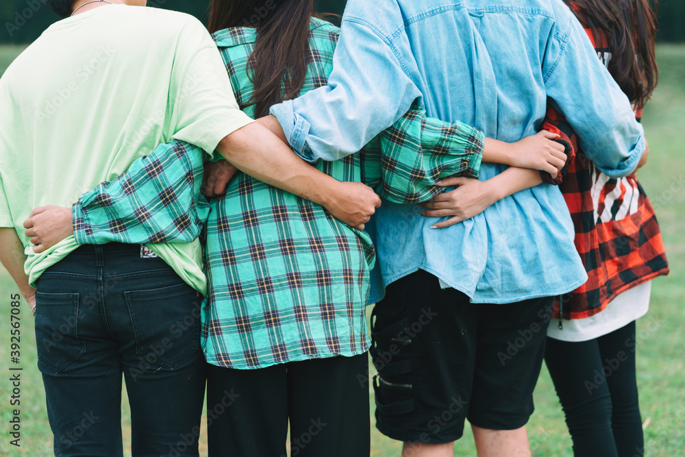 Group of Asian people huddle together