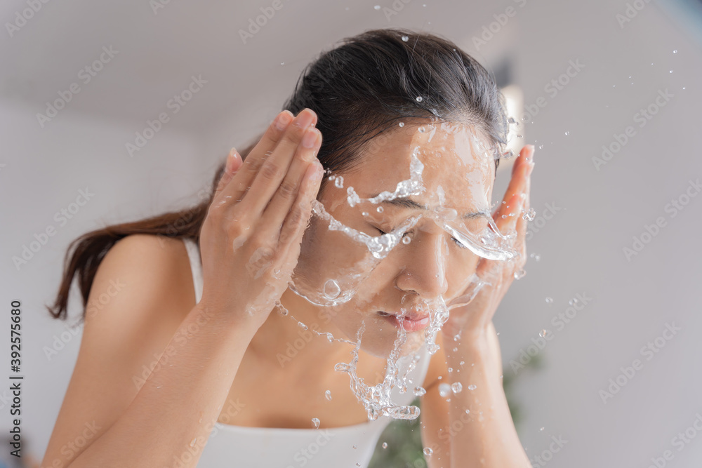 Beautiful female asian use water to wash your face Wash face.