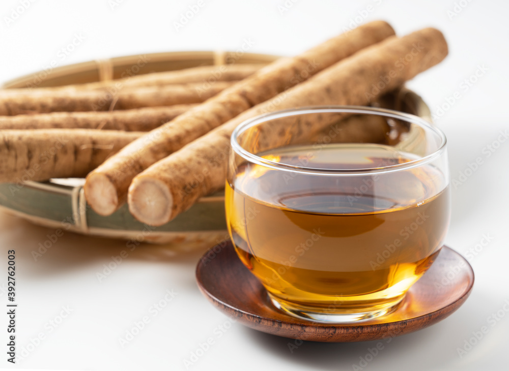 Burdock tea on a white background