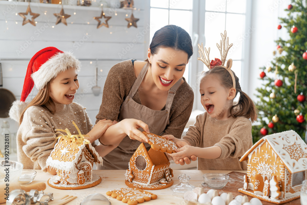 Family cooking gingerbread house