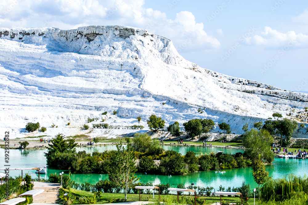 white travertine hill and lake