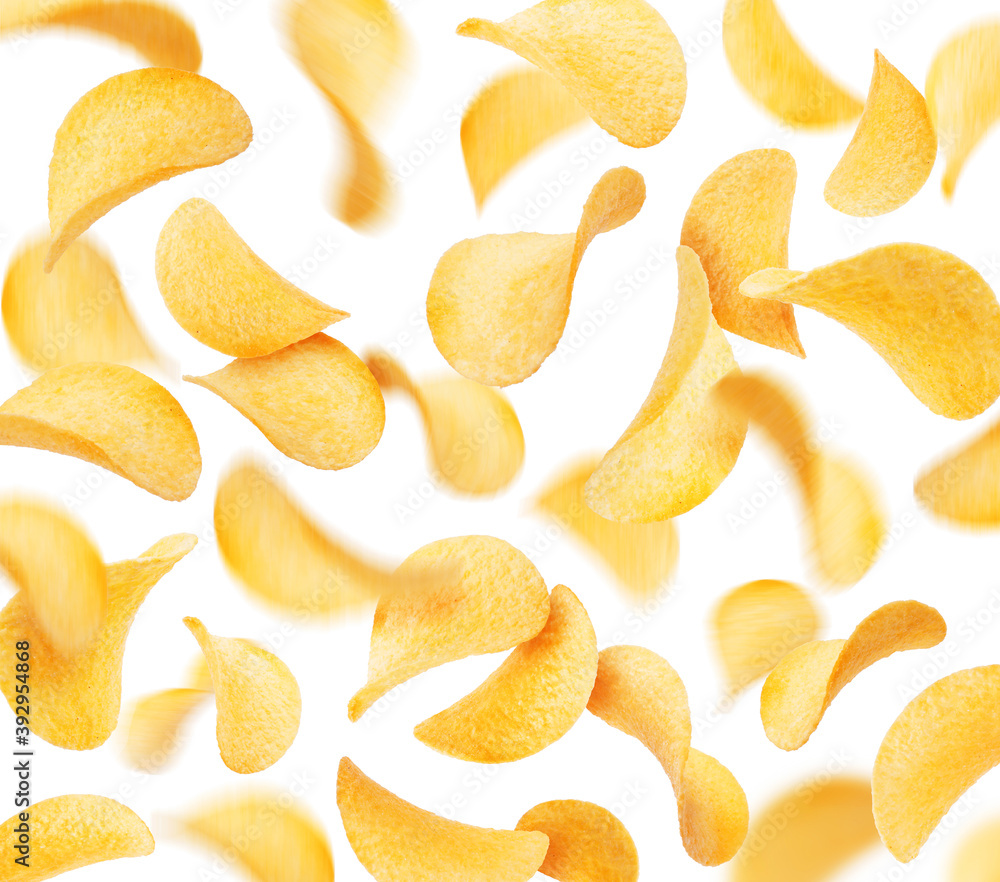 Potato chips in a chaotic position in the air, isolated on a white background