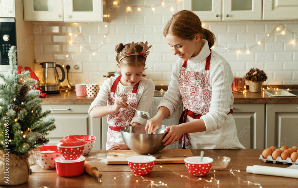 happy family mother and child  bake christmas cookies.