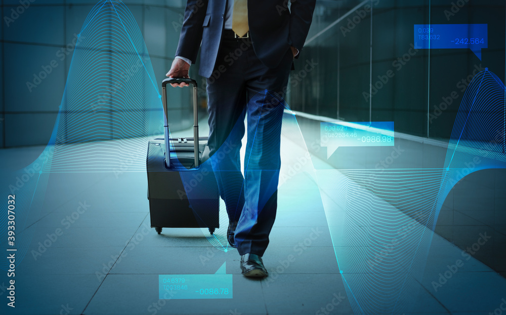 Businessman walking with his luggage