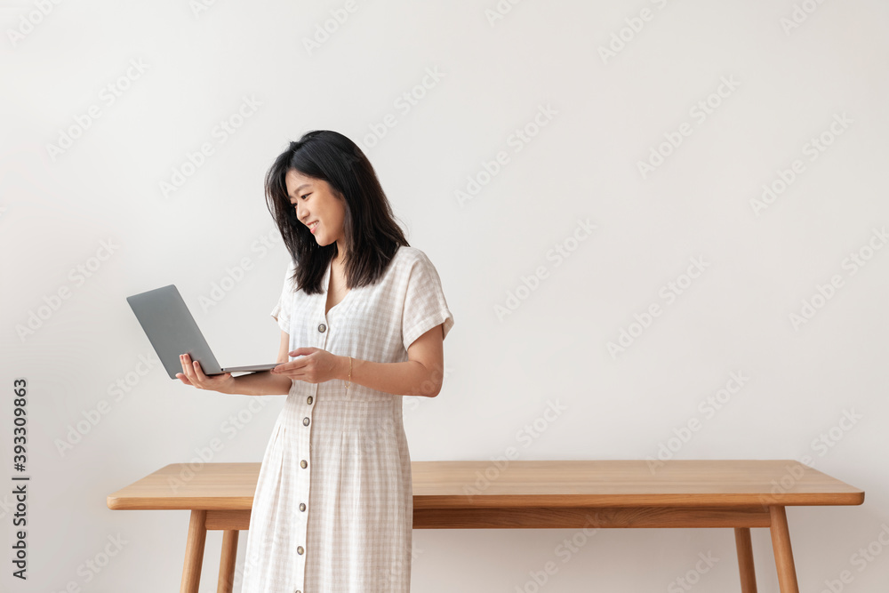 Happy Asian woman working from home