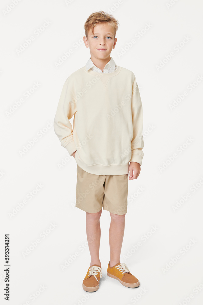 Boy wearing casual white sweatshirt in studio