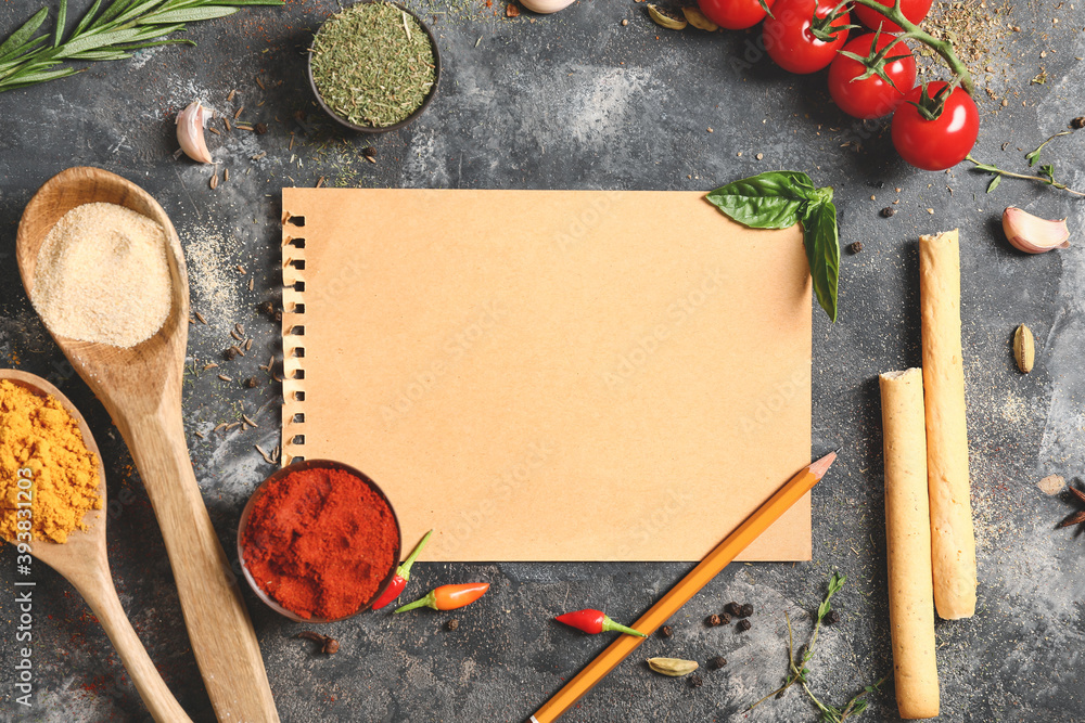 Blank beige paper and spices on grey table