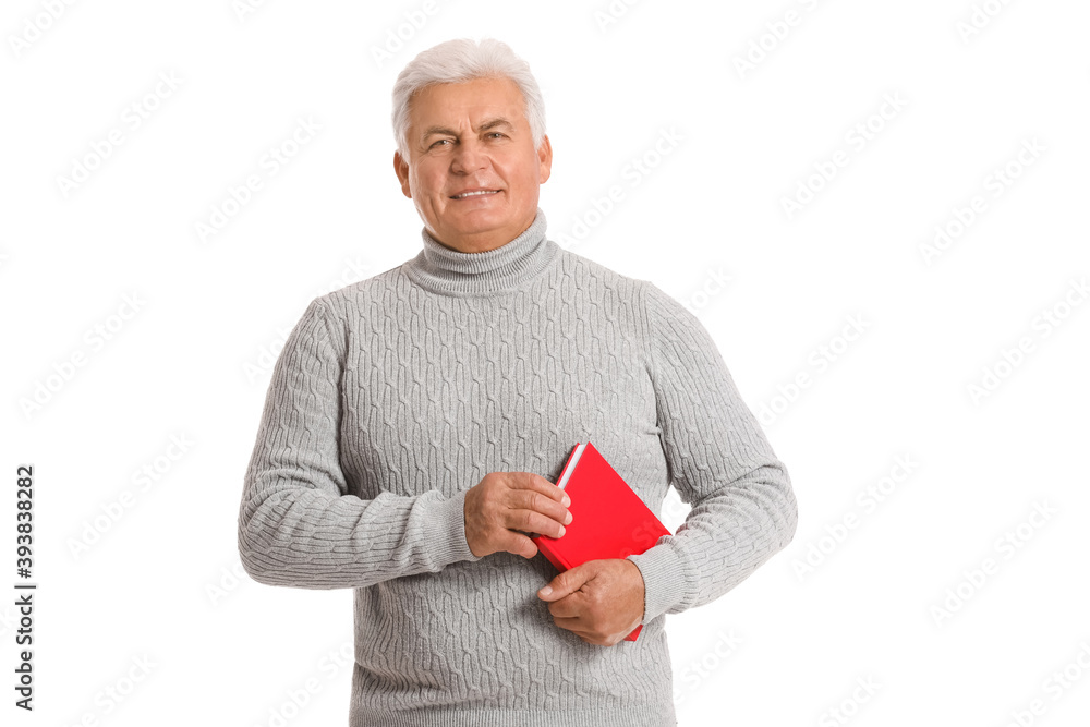 Mature man with book on white background