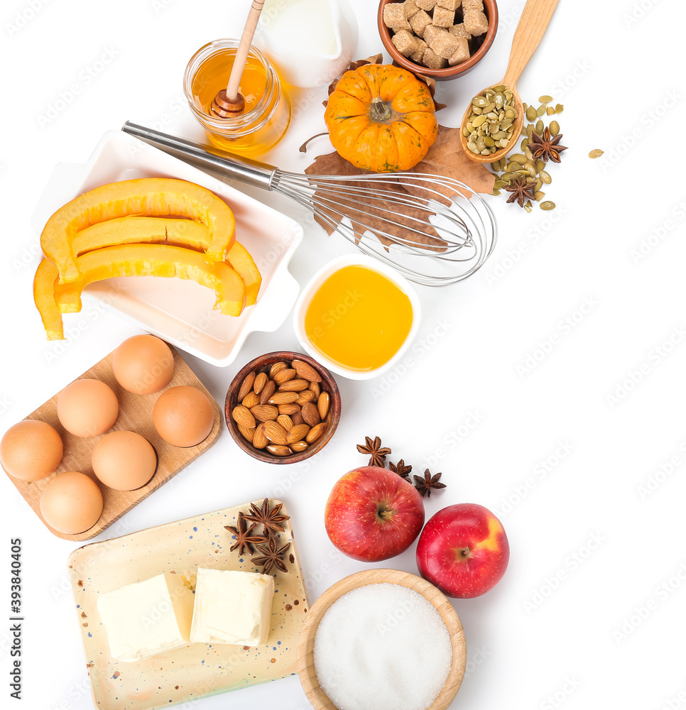 Ingredients for preparing pumpkin pie on white background