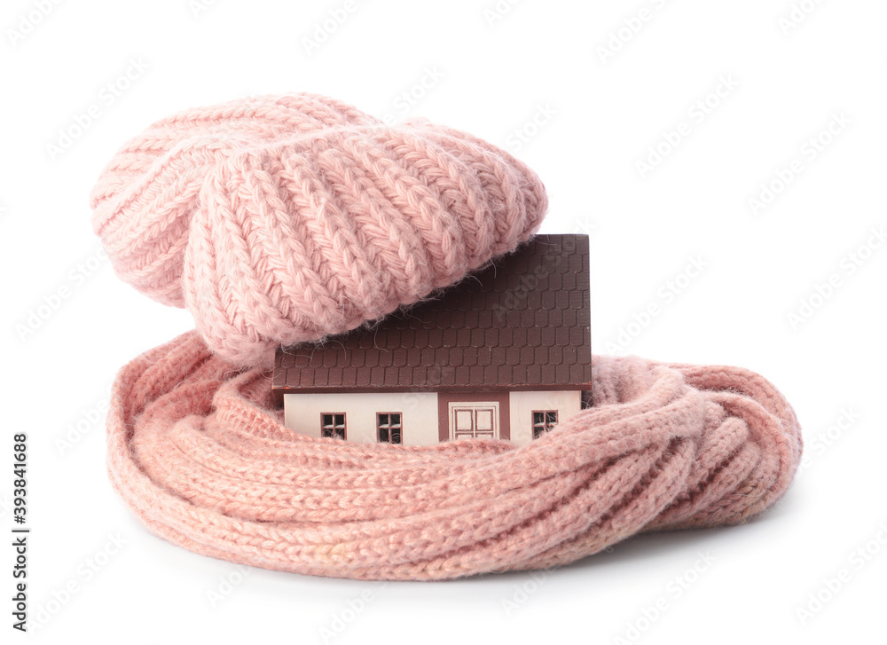 Figure of house and warm scarf on white background. Concept of heating season