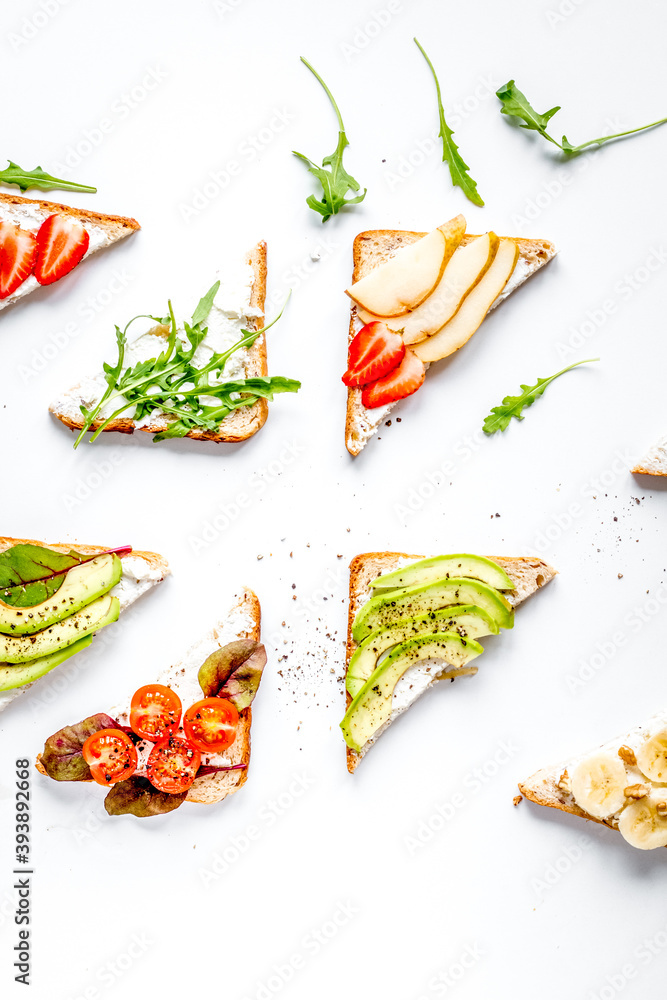 fitness breskfast with homemade sandwiches white table background top view