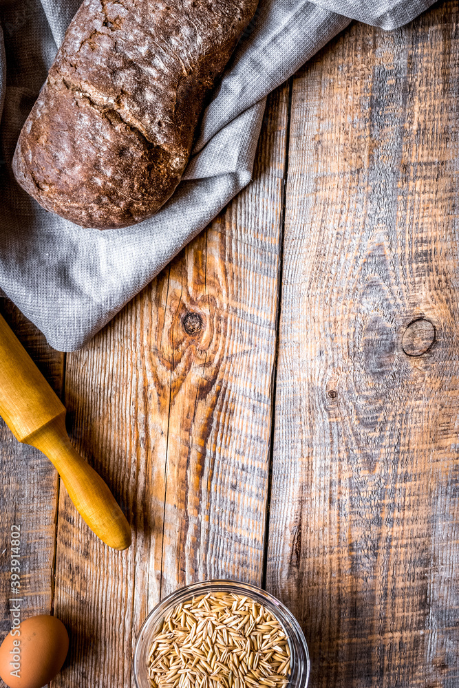 Baking bread ingredients on wooden table background top view mockup