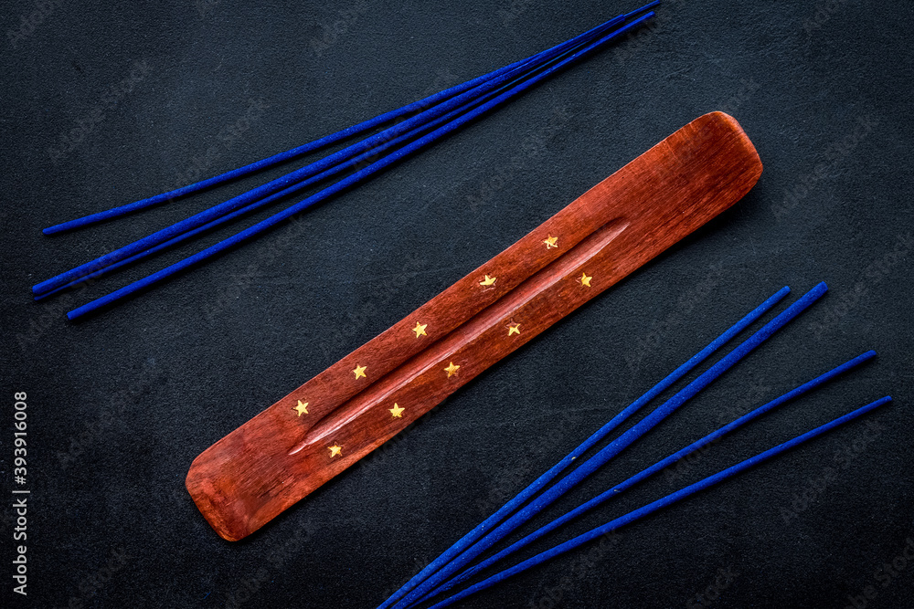 air freshener sticks on dark blue background top view