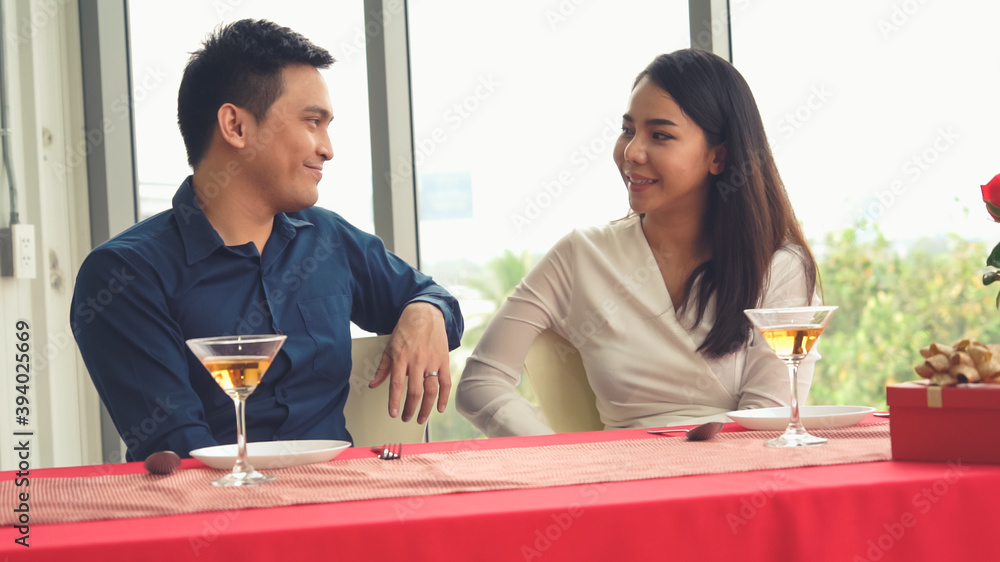 Happy romantic couple eating lunch at restaurant . Couple anniversary celebration and lifestyle .