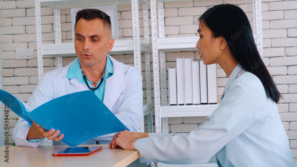 Doctor in professional uniform examining patient at hospital or medical clinic. Health care , medica