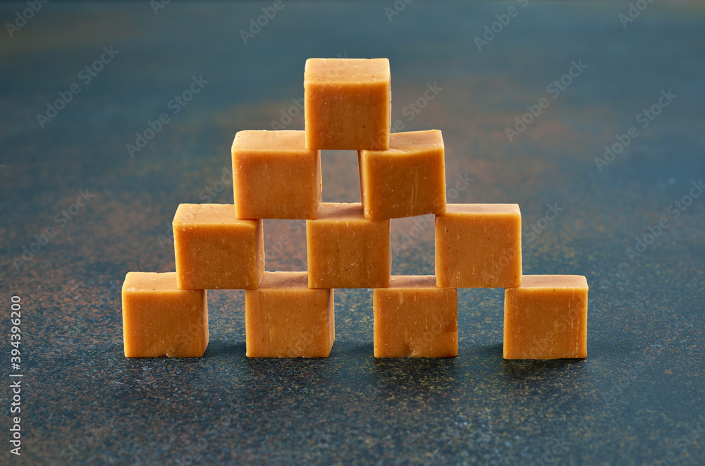 caramel candies on dark background