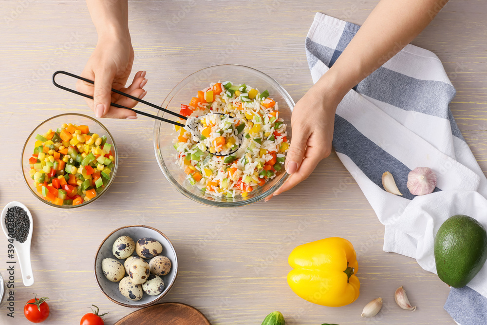 Woman with bowl of rice salad