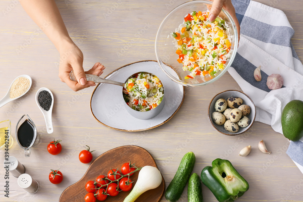 Woman with bowl of rice salad