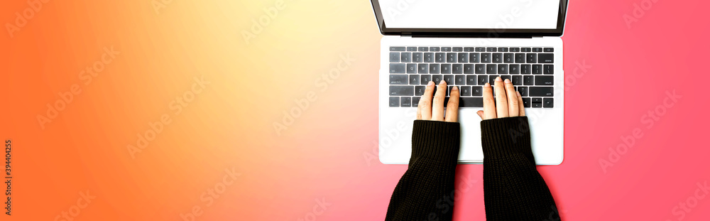 Person using a laptop computer from above